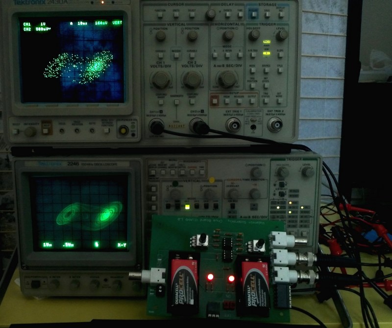 Circuit board with double scroll attractors on analog and digital scopes